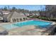 Community pool with chairs and tables, great for relaxing and socializing at 720 Lanarck Way, Peachtree City, GA 30269
