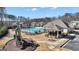 Community pool area with playground and grilling area, perfect for summer fun at 720 Lanarck Way, Peachtree City, GA 30269