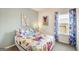 Bright bedroom with a full-sized bed and colorful bedding at 1486 Trellis Court (Lot 43), Hampton, GA 30228