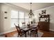 Breakfast nook with hardwood floors and antique wooden table at 1152 Chadwick Lakes Dr, Lawrenceville, GA 30043