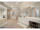 Elegant main bathroom with double vanities and a large soaking tub at 1152 Chadwick Lakes Dr, Lawrenceville, GA 30043