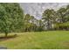 Large backyard with lush green grass at 5225 Bailey Sw Rd, Conyers, GA 30094