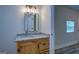 Bathroom with granite vanity and wood cabinets at 1198 E Atlanta Rd, Stockbridge, GA 30281