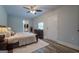 Main bedroom with wood-look floors and ceiling fan at 1198 E Atlanta Rd, Stockbridge, GA 30281