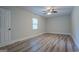 Spacious bedroom with wood-look floors and ceiling fan at 1198 E Atlanta Rd, Stockbridge, GA 30281