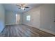 Bright bedroom with wood-look floors and ceiling fan at 1198 E Atlanta Rd, Stockbridge, GA 30281