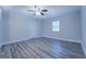 Bright bedroom with hardwood floors and a ceiling fan at 1198 E Atlanta Rd, Stockbridge, GA 30281