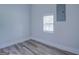 Simple bedroom with hardwood floors and a window at 1198 E Atlanta Rd, Stockbridge, GA 30281
