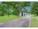 Ranch home with a large yard and long driveway at 1198 E Atlanta Rd, Stockbridge, GA 30281