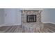 Stone fireplace with a modern mantel and glass doors at 1198 E Atlanta Rd, Stockbridge, GA 30281