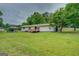 Ranch-style home with a carport and deck at 1198 E Atlanta Rd, Stockbridge, GA 30281