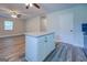 White kitchen cabinets and granite countertop island at 1198 E Atlanta Rd, Stockbridge, GA 30281