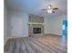 Living room with hardwood floors and a stone fireplace at 1198 E Atlanta Rd, Stockbridge, GA 30281