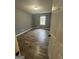 Comfortable bedroom featuring wood flooring, neutral paint, and a window allowing natural light at 54 Cross Branches, Acworth, GA 30101