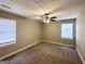 Spacious bedroom with ceiling fan and neutral carpeting at 50 Macon Se Pl, Atlanta, GA 30354