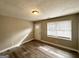 Spacious living area featuring hardwood floors and large windows at 50 Macon Se Pl, Atlanta, GA 30354