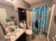 Bathroom with a tub shower combo and Finding Nemo themed shower curtain at 177 Villa Rosa Way, Temple, GA 30179