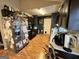 Kitchen with dark wood cabinets and stainless steel refrigerator at 177 Villa Rosa Way, Temple, GA 30179