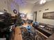 Living Room with Christmas tree, sectional sofa, and hardwood floors at 177 Villa Rosa Way, Temple, GA 30179