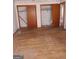 Large bedroom with hardwood floors and ample closet space at 6238 Lance Ln, Riverdale, GA 30274