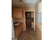 Kitchen with light wood cabinets and tiled floor at 6238 Lance Ln, Riverdale, GA 30274