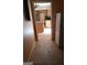 View of kitchen from hallway with light wood cabinets at 6238 Lance Ln, Riverdale, GA 30274