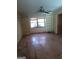 Bright living room featuring hardwood floors and built-in shelving at 6238 Lance Ln, Riverdale, GA 30274