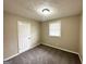 Cozy bedroom with neutral walls, carpet flooring, and ample natural light at 425 Cologne Se Dr, Atlanta, GA 30354