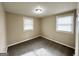 Well-lit bedroom with neutral walls, carpet flooring, and two windows at 425 Cologne Se Dr, Atlanta, GA 30354