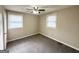 Bright bedroom with ceiling fan, neutral walls, and carpet flooring at 425 Cologne Se Dr, Atlanta, GA 30354
