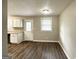 Open dining area with wood-look floors and access to the kitchen at 425 Cologne Se Dr, Atlanta, GA 30354