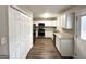 Modern kitchen with white cabinets, granite countertops, and stainless steel appliances at 425 Cologne Se Dr, Atlanta, GA 30354