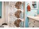 Bathroom with floral shower curtain and updated vanity at 315 Charlotte Blvd, Stockbridge, GA 30281