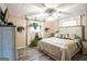 Bright bedroom with a large bed, window, and ceiling fan at 315 Charlotte Blvd, Stockbridge, GA 30281