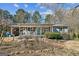 Charming ranch home with covered porch and landscaped yard at 315 Charlotte Blvd, Stockbridge, GA 30281