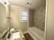 Updated bathroom with granite vanity and marble tile shower/tub at 348 Cologne Se Dr, Atlanta, GA 30354