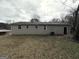 Back of house showing a large yard and detached storage building at 348 Cologne Se Dr, Atlanta, GA 30354