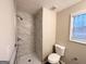 Clean bathroom with a stand-up shower, toilet and granite vanity at 1351 Renee Dr, Decatur, GA 30035