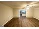 Bright living room with hardwood floors and an open concept view into the kitchen at 1351 Renee Dr, Decatur, GA 30035