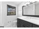 Updated bathroom with vanity, shower, and toilet at 305 Kelly Dr, Fayetteville, GA 30214