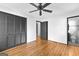 Bedroom with hardwood floors, closet, and access to bath at 305 Kelly Dr, Fayetteville, GA 30214