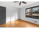 Bright bedroom with hardwood floors and window at 305 Kelly Dr, Fayetteville, GA 30214