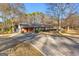 Front view of a ranch house with a long driveway at 305 Kelly Dr, Fayetteville, GA 30214