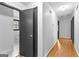 Bright hallway with hardwood floors and access to rooms at 305 Kelly Dr, Fayetteville, GA 30214
