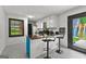 Eat-in kitchen featuring breakfast bar with black stools and backyard access at 305 Kelly Dr, Fayetteville, GA 30214