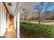 Front porch with white columns overlooking a green lawn at 305 Kelly Dr, Fayetteville, GA 30214