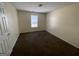 Simple bedroom with carpeted floor and a window at 270 Mountain Way, Covington, GA 30016