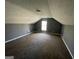 Bonus room featuring sloped ceilings and a window at 270 Mountain Way, Covington, GA 30016