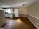 Kitchen's adjacent dining area with laminate flooring at 270 Mountain Way, Covington, GA 30016