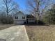 House exterior featuring a two-car garage and a spacious front yard at 270 Mountain Way, Covington, GA 30016